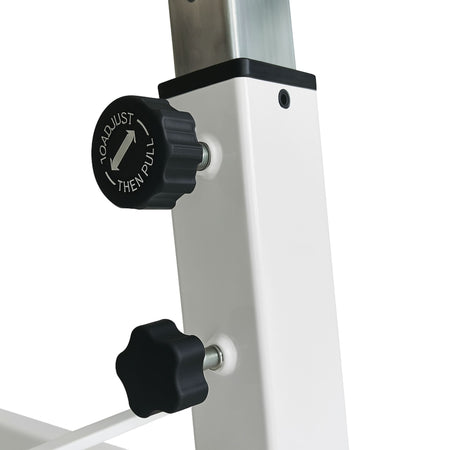 Close-up of height adjustment knobs on white Cannons UK gymnastics bar.