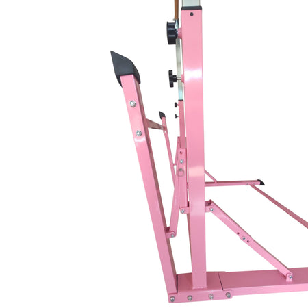Pink folding gymnastics bar set up indoors for home training.