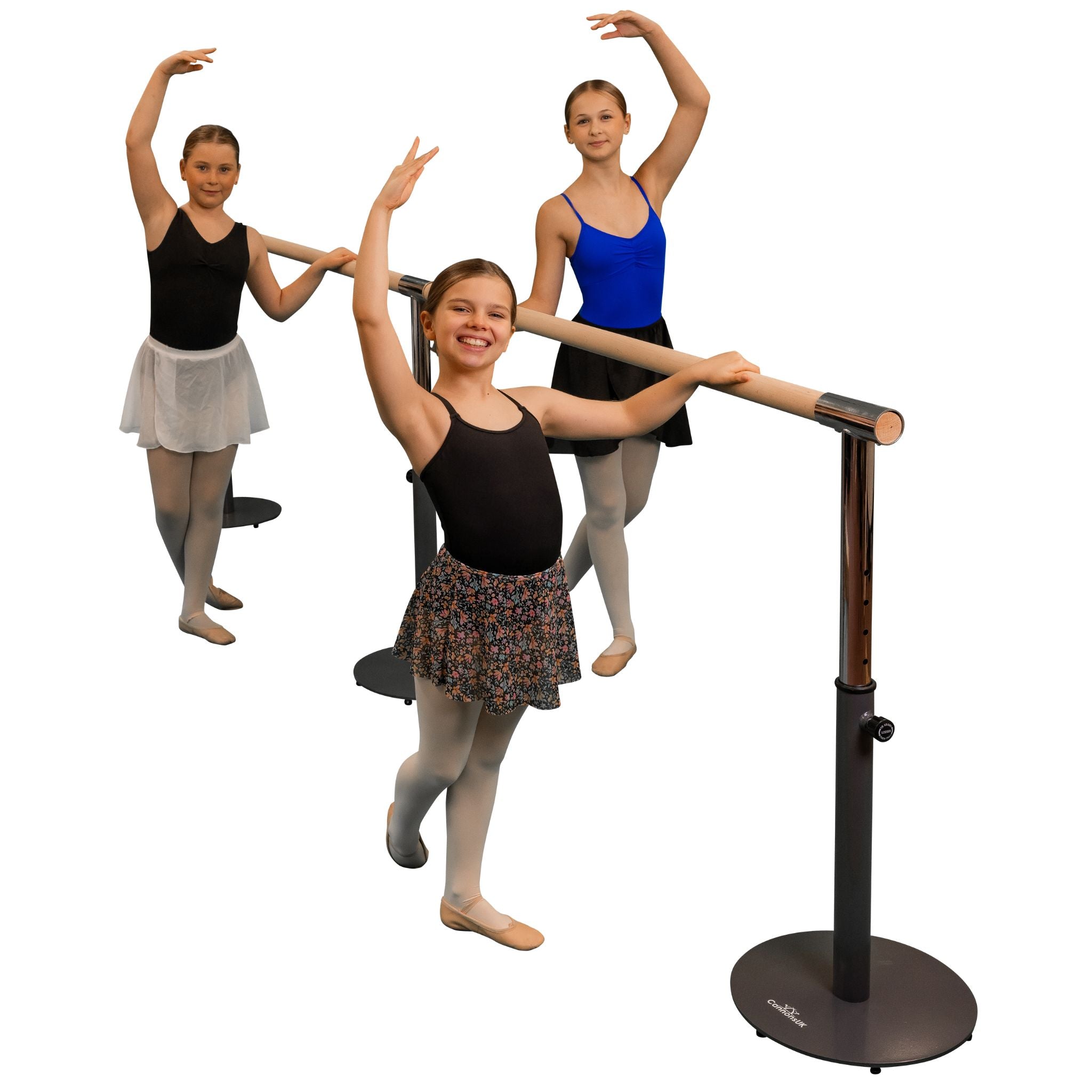 Three individuals posing with a freestanding and portable ballet barre which is black in color, with a main barre and an extension included.