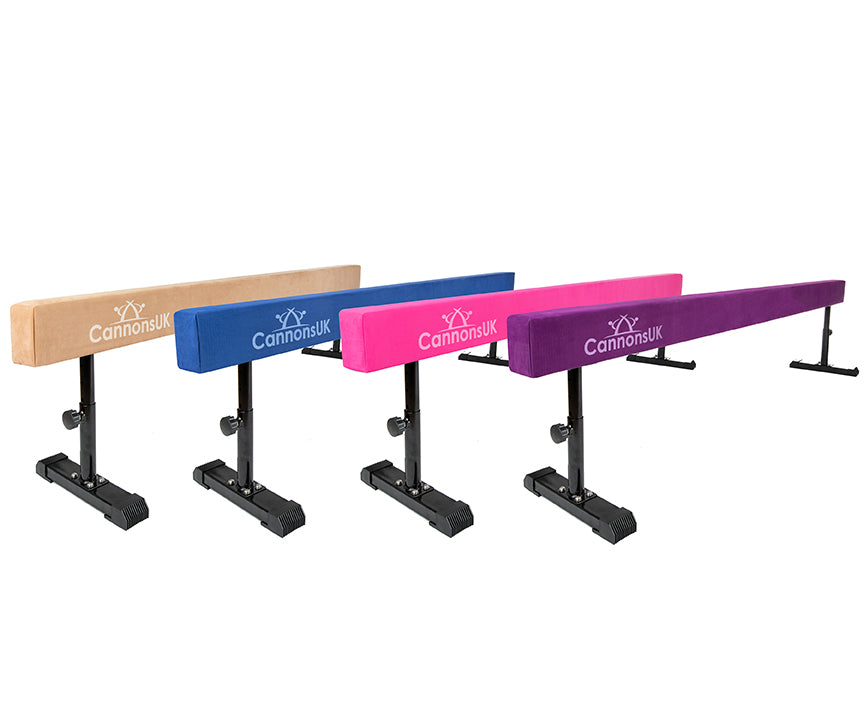 Cannons UK 8ft solid gymnastic beams set in tan, pink, purple, and blue for gymnastics training and home practice.