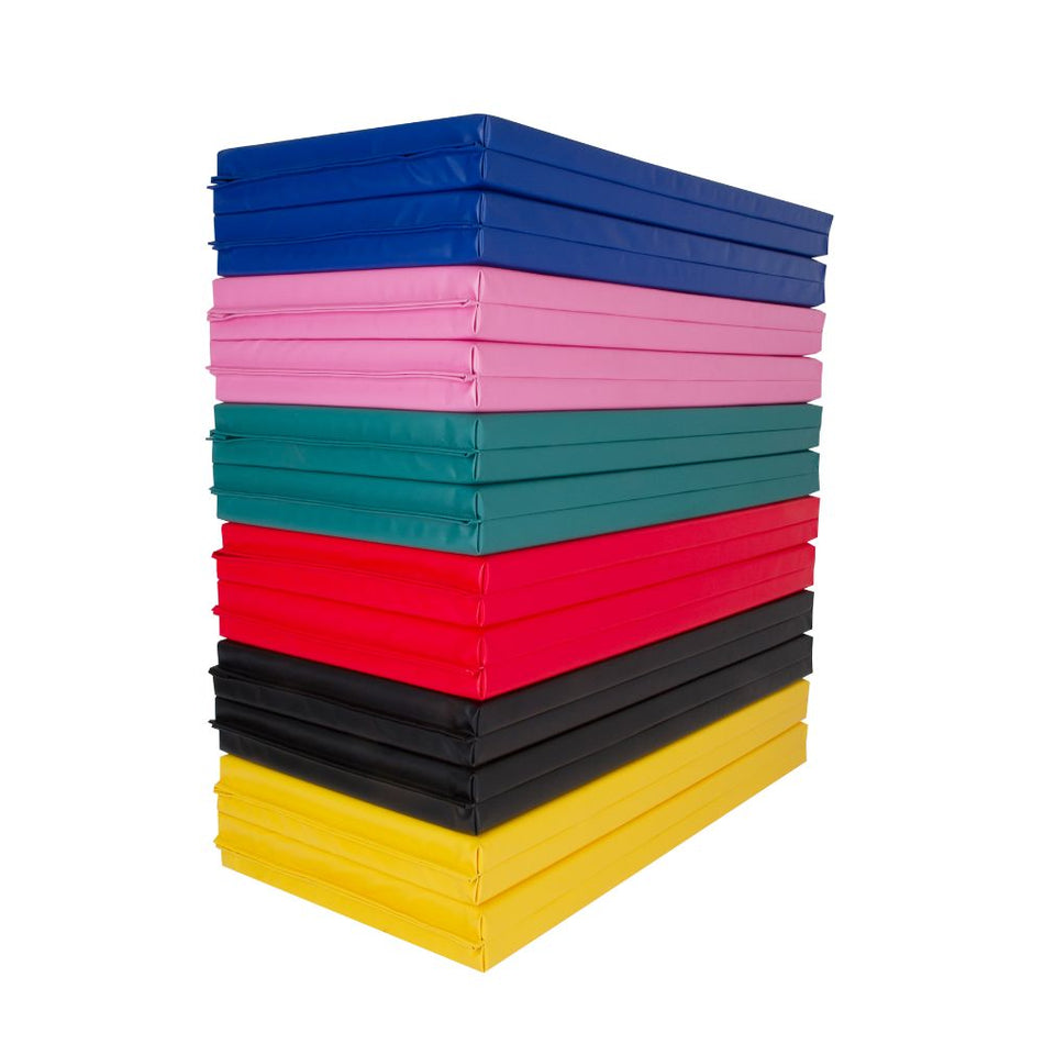 Stack of Cannons UK foldable double mats in multiple colours including blue, pink, red, black, yellow, and green.