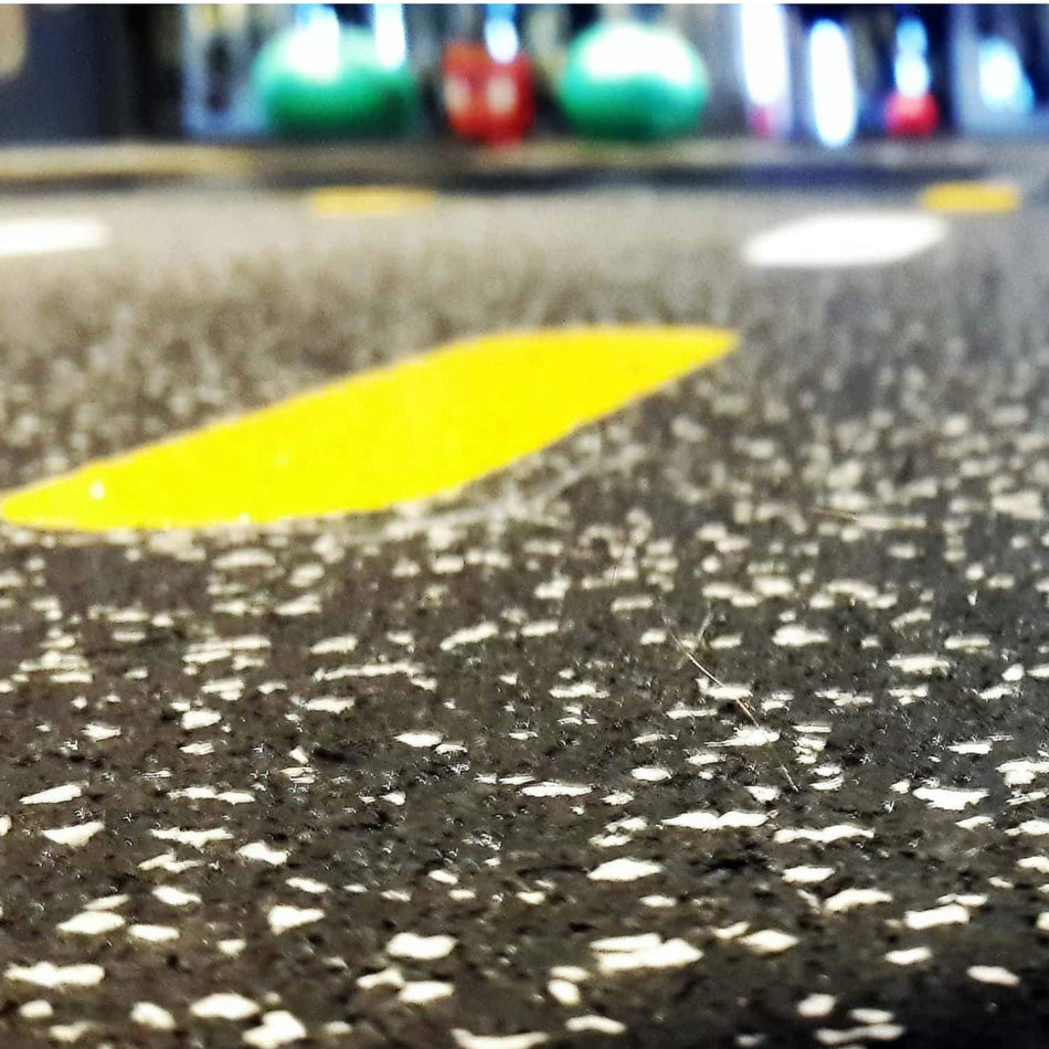 Cannons UK Smirna Series 8mm rubber flooring — ground-level macro with yellow line marking for functional training zones and classes
