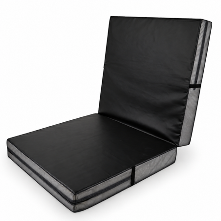Black bi-fold crash mat with one half raised upright.