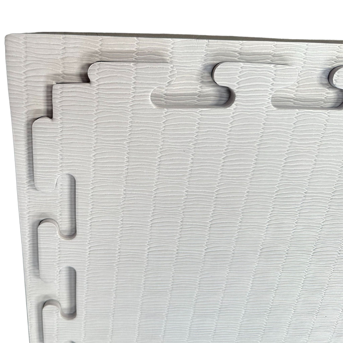 Close-up of interlocking edges on 40 mm tatami MMA mats
