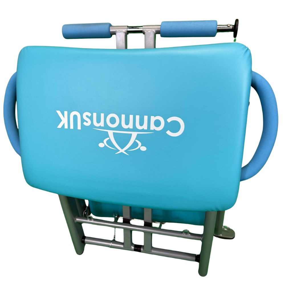 Blue Pilates chair featuring adjustable spring resistance mechanism