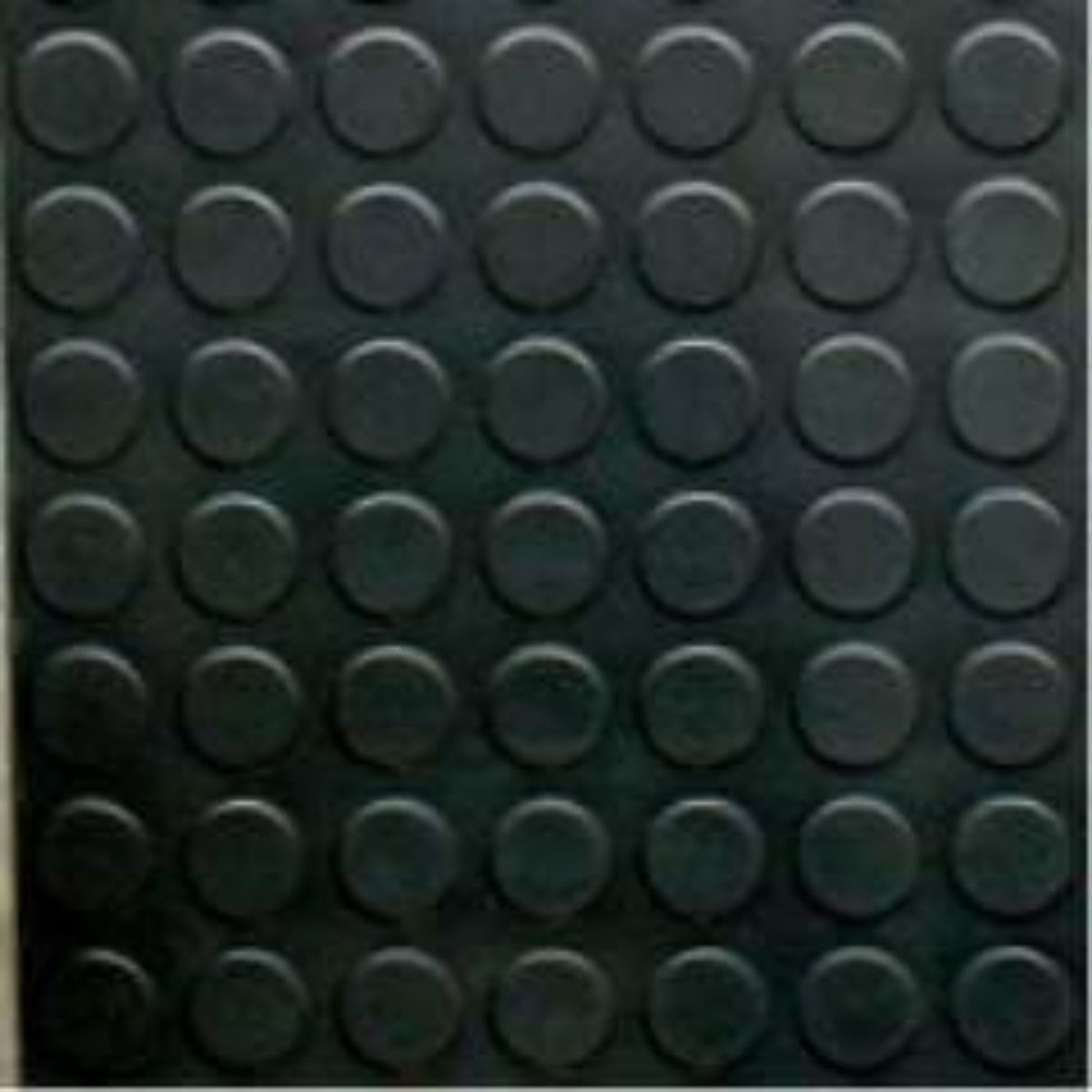 Close-up view of Cannons UK rubber stud flooring showing durable circular studded surface texture for gyms, workshops, and industrial use.