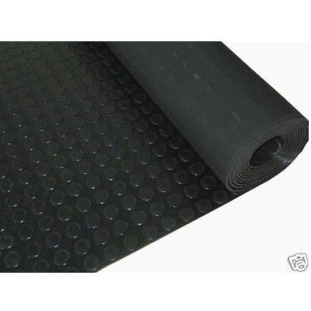 Black Cannons UK rubber stud flooring roll partially unrolled, displaying heavy-duty non-slip studded design ideal for gyms, warehouses, and commercial flooring.