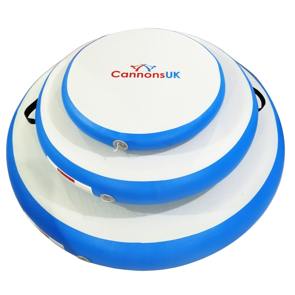 A blue and white Cannons UK Air Track Pro Air Spot inflatable, with the brand logo visible on the top blue layer.