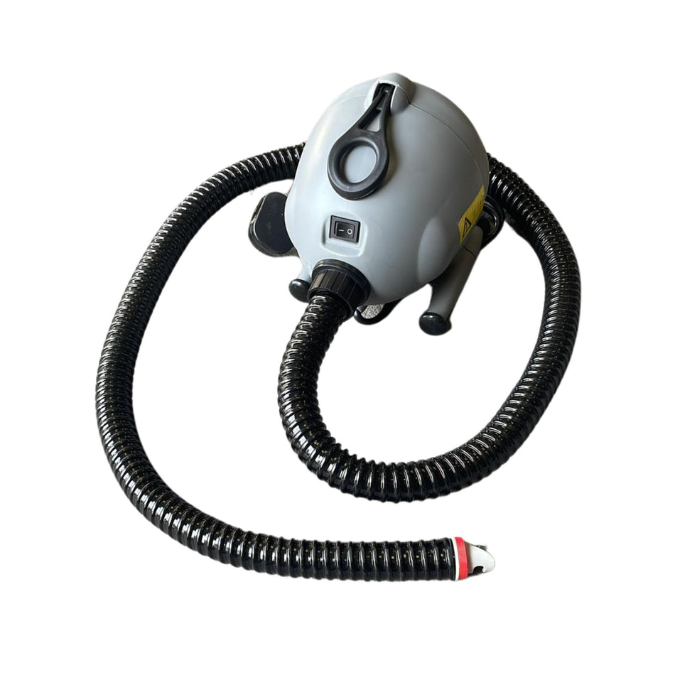 An electric blower with a grey body, black hose, and red valve, designed for inflating air tracks.