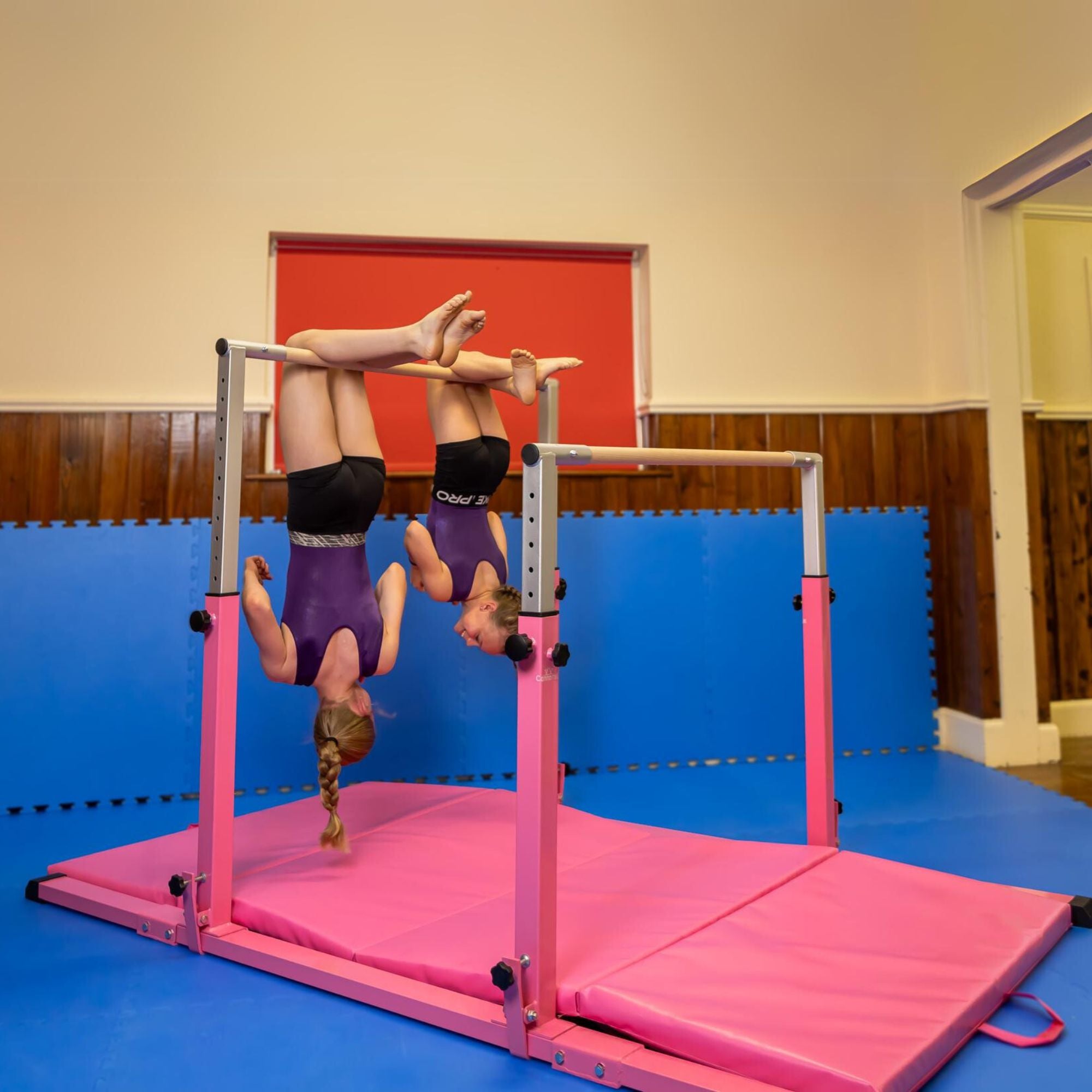 Parallel Bars pink — second lifestyle scene in gym setting for strength and skill development