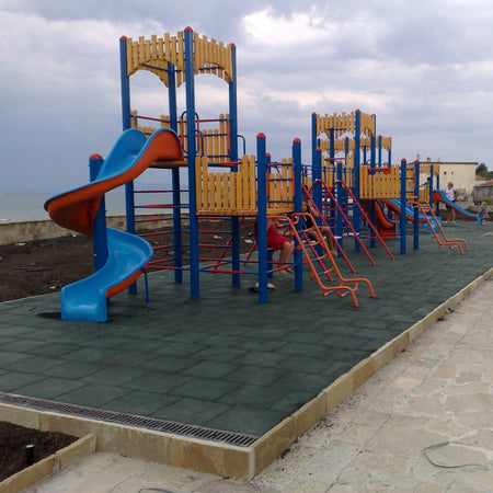 Installed green tiles — wide play zone view beneath equipment.
