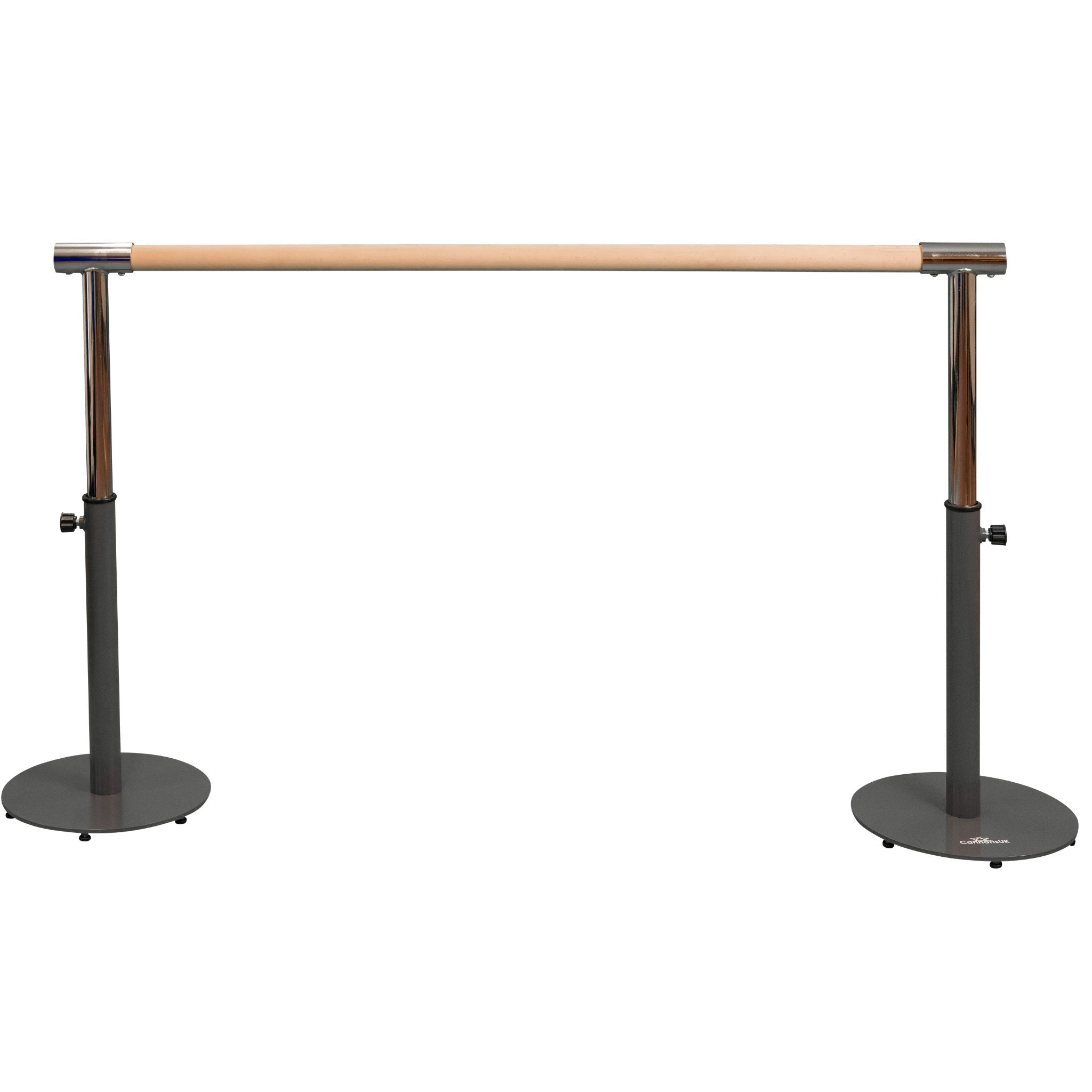 Two young girls using a black freestanding portable ballet barre with adjustable height, standing on a white background.