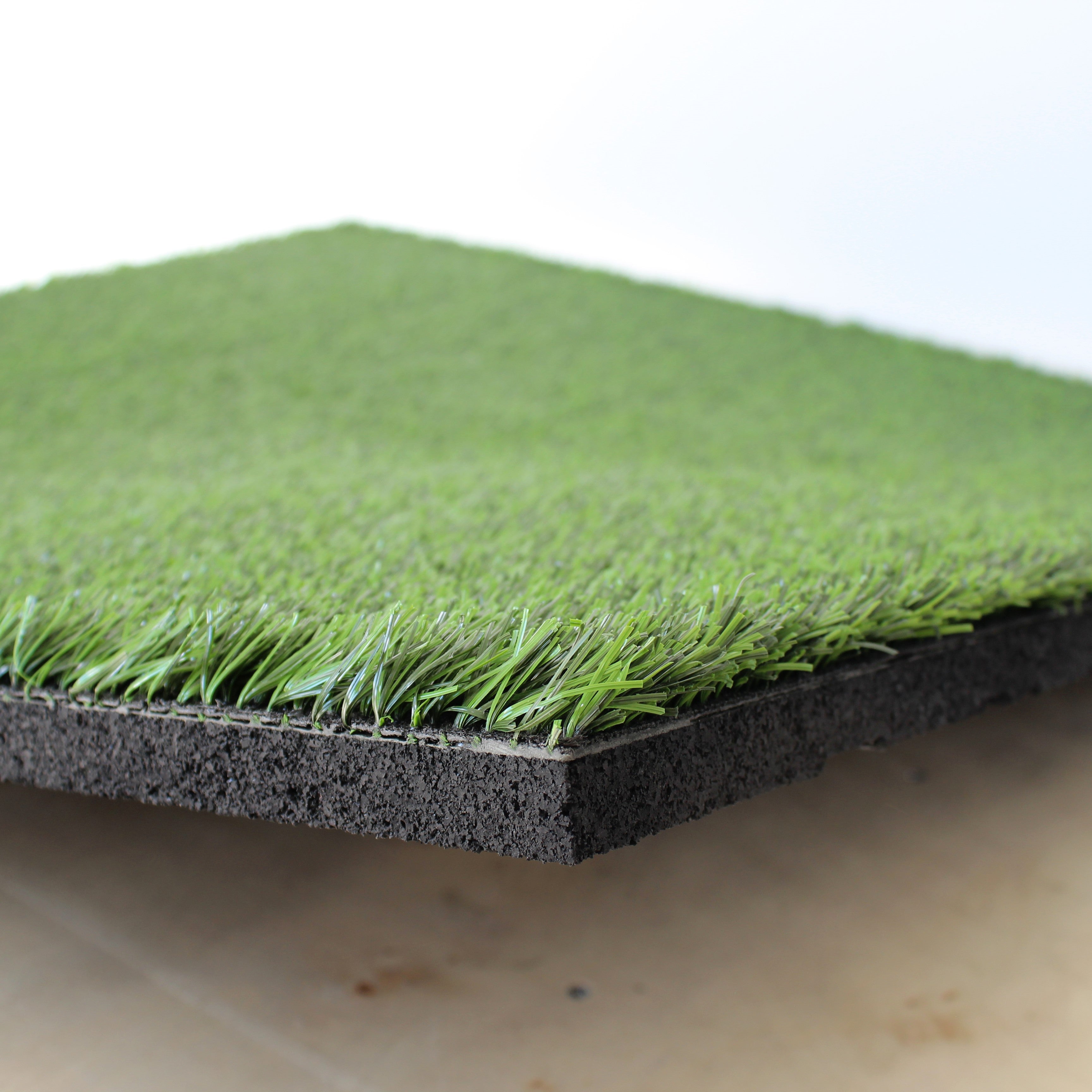Corner close-up of 27m² artificial grass rubber floor tile  
