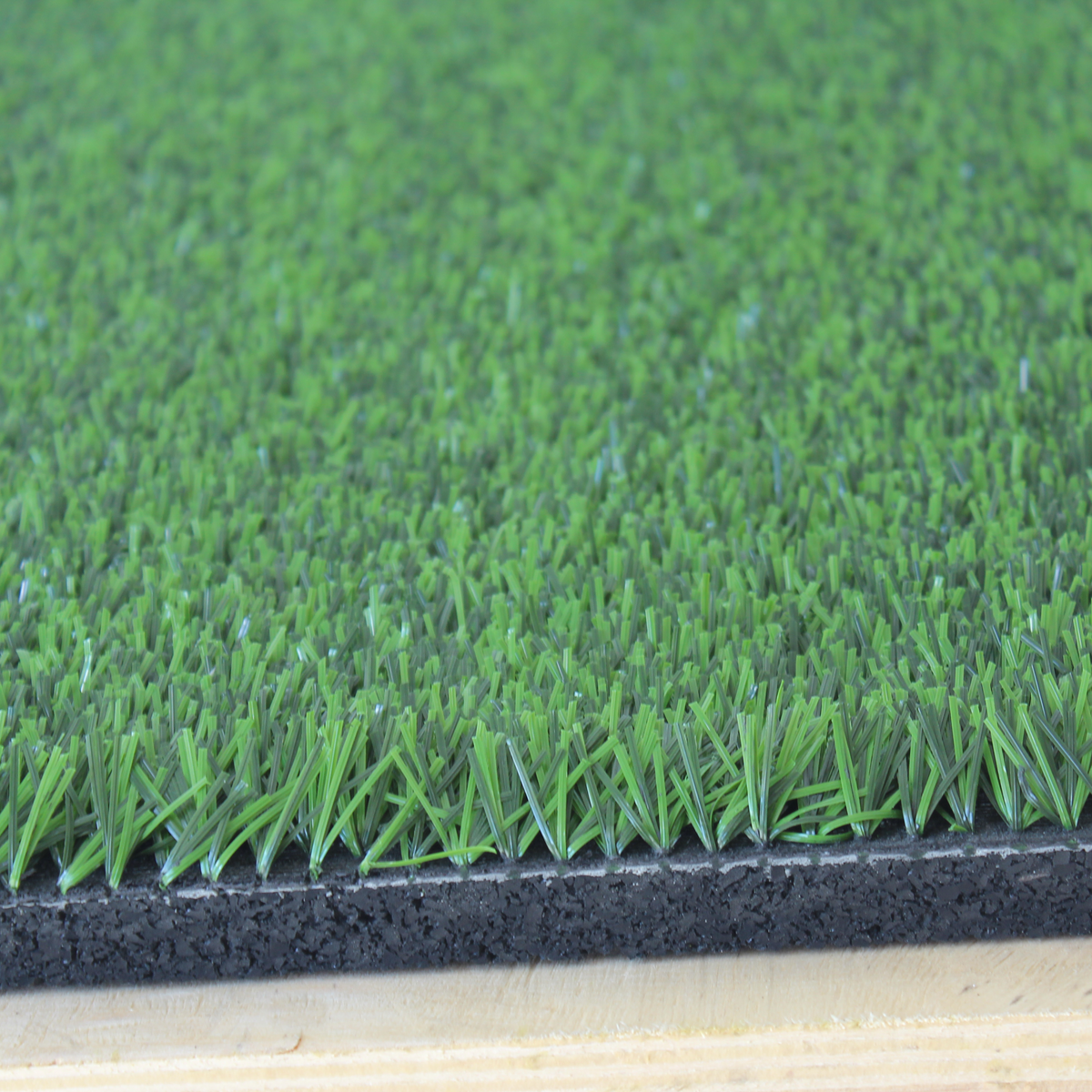 Edge close-up showing construction of 27m² grass-topped tile  

