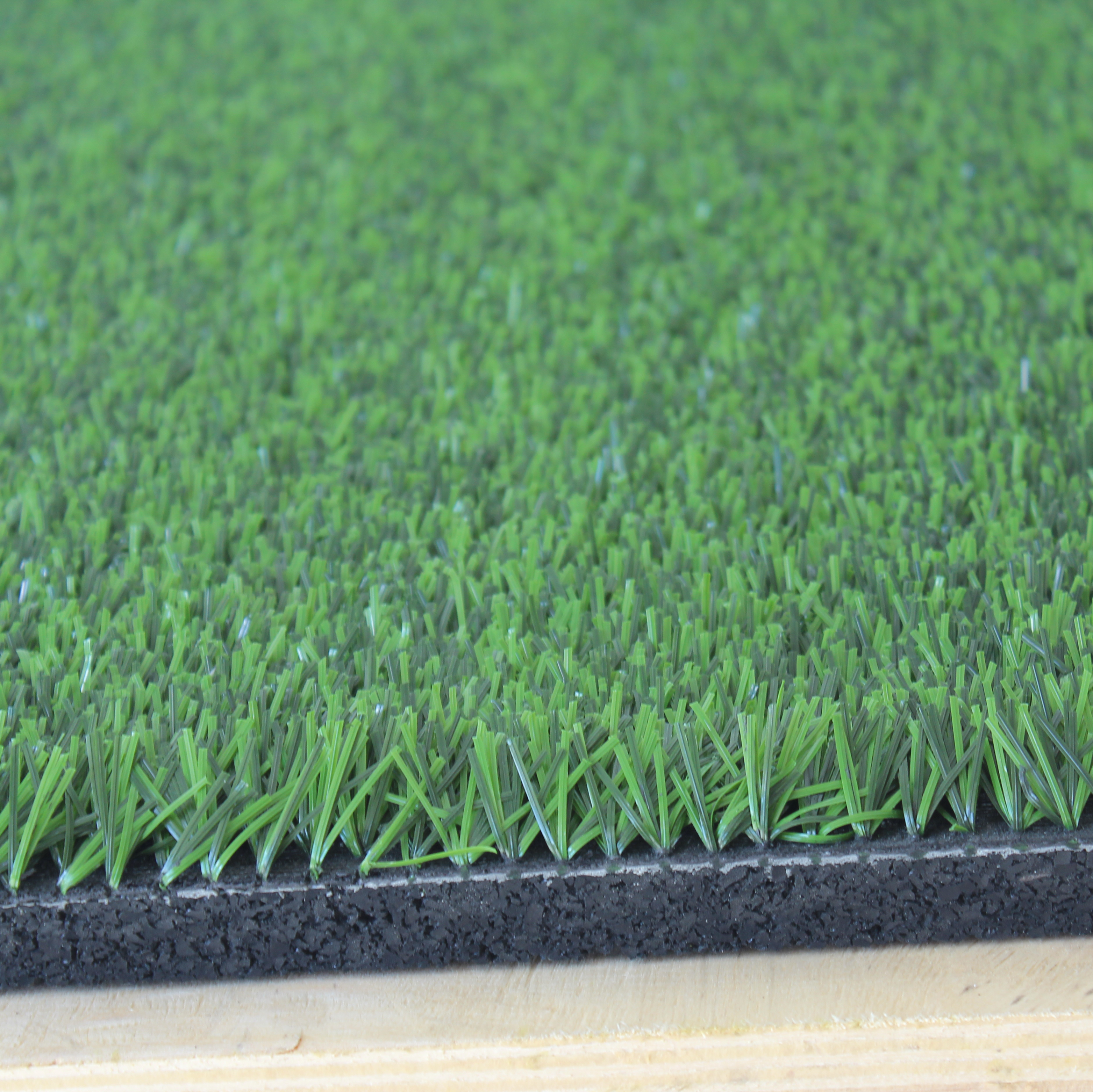 Edge close-up showing construction of 27m² grass-topped tile  
