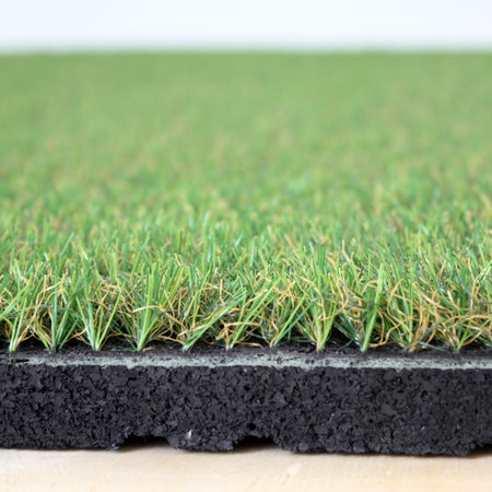 Angled studio shot of artificial grass floor tile  
