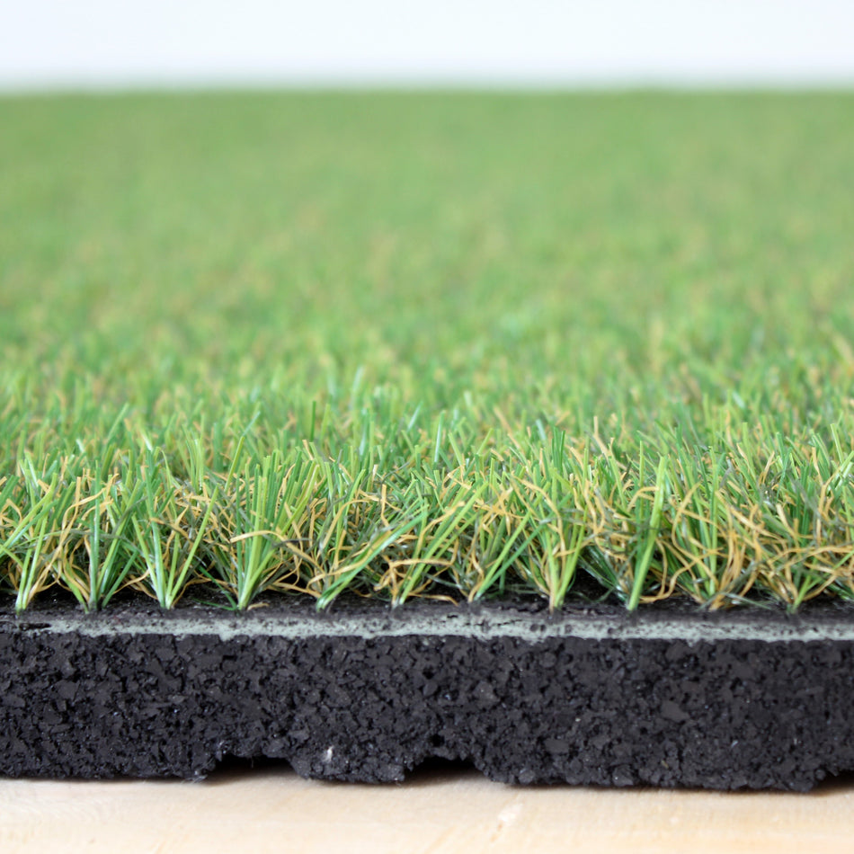 Angled studio shot of artificial grass floor tile  
