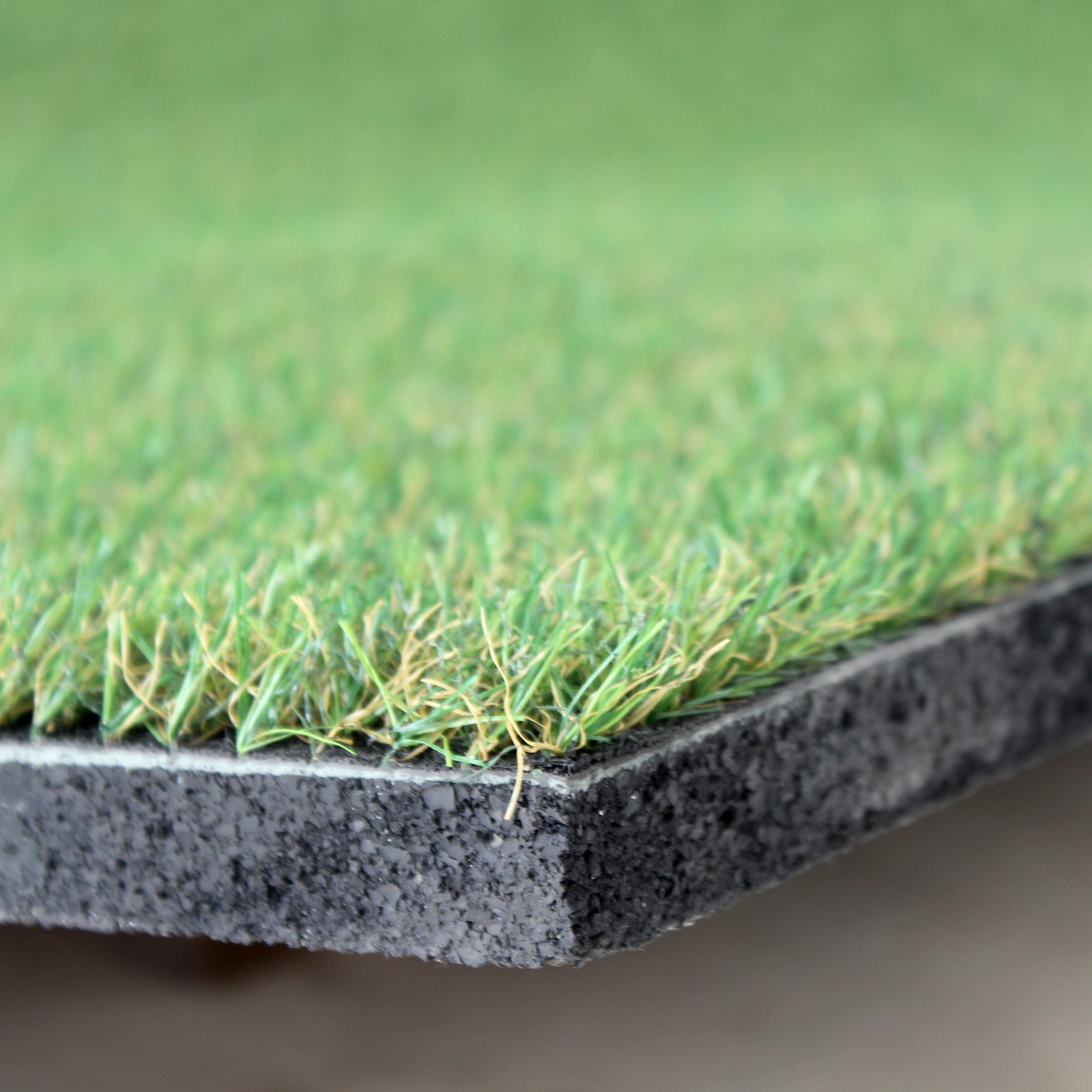 Underside of grass-topped rubber tile showing base texture  
