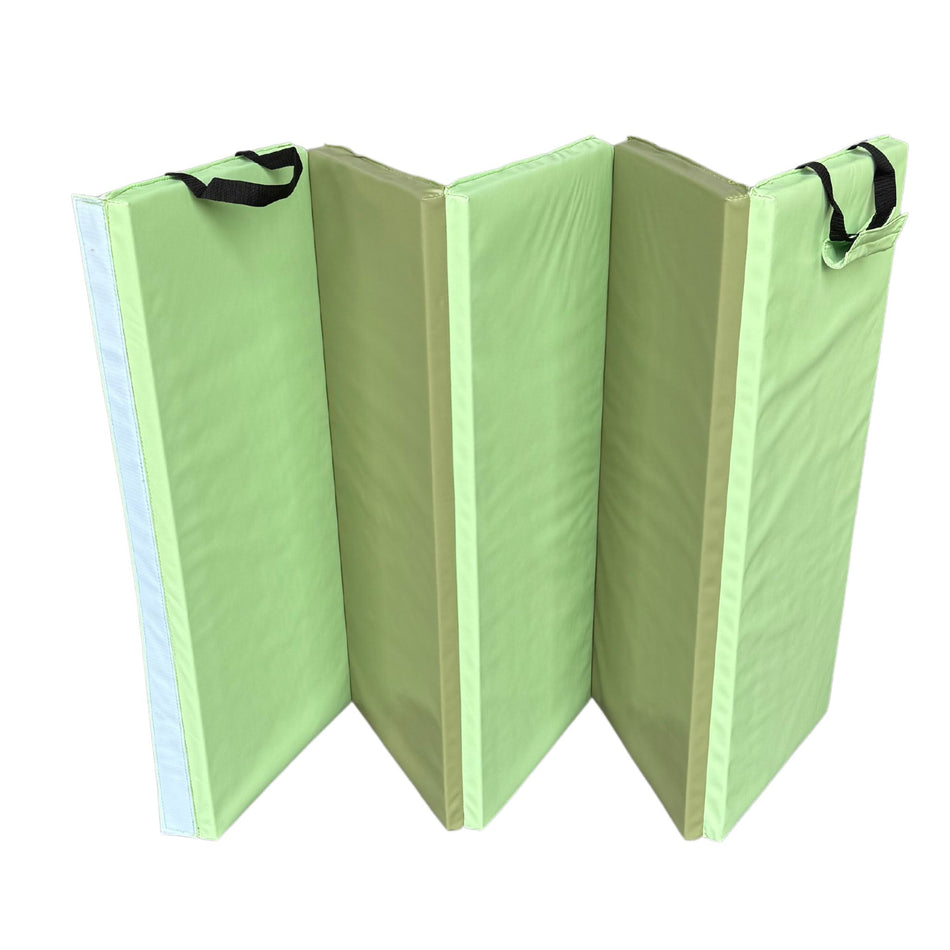 Folded green 2-tone gymnastics mat
