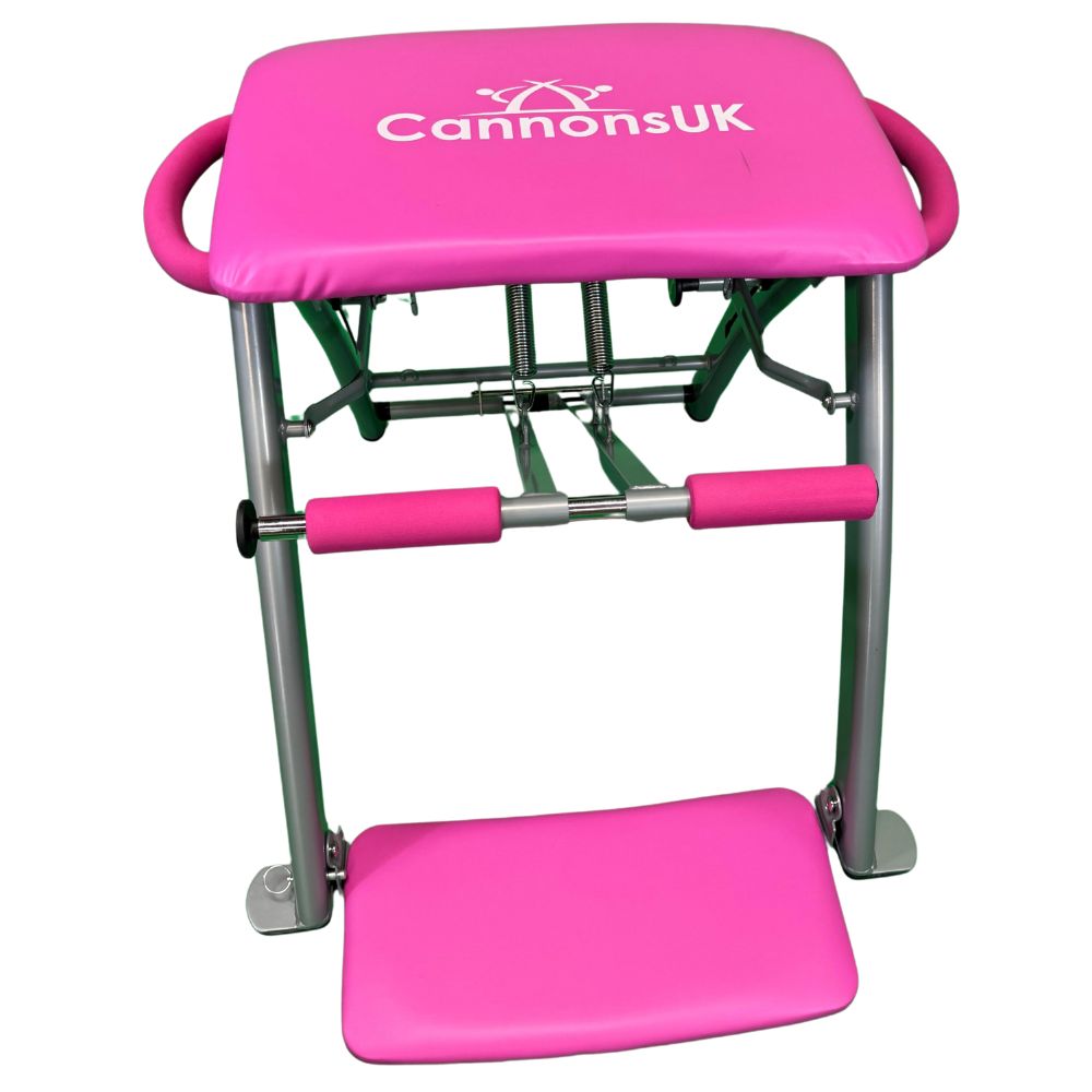 Pink Pilates chair with adjustable spring resistance for varied workouts