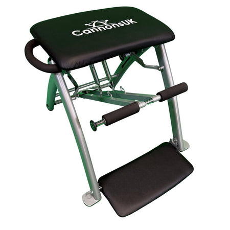 Side view of professional black Pilates chair with sturdy steel frame