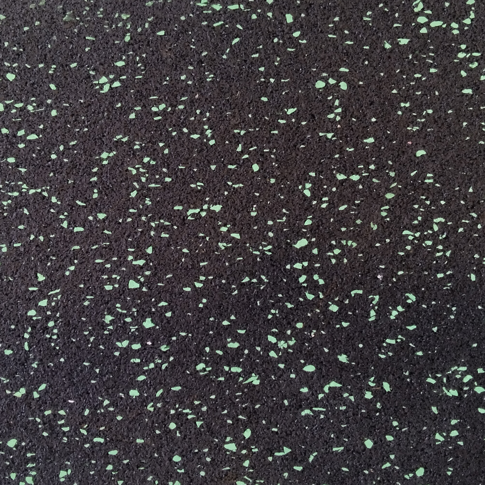 Close corner view of green Smirna Series 10mm flooring  
