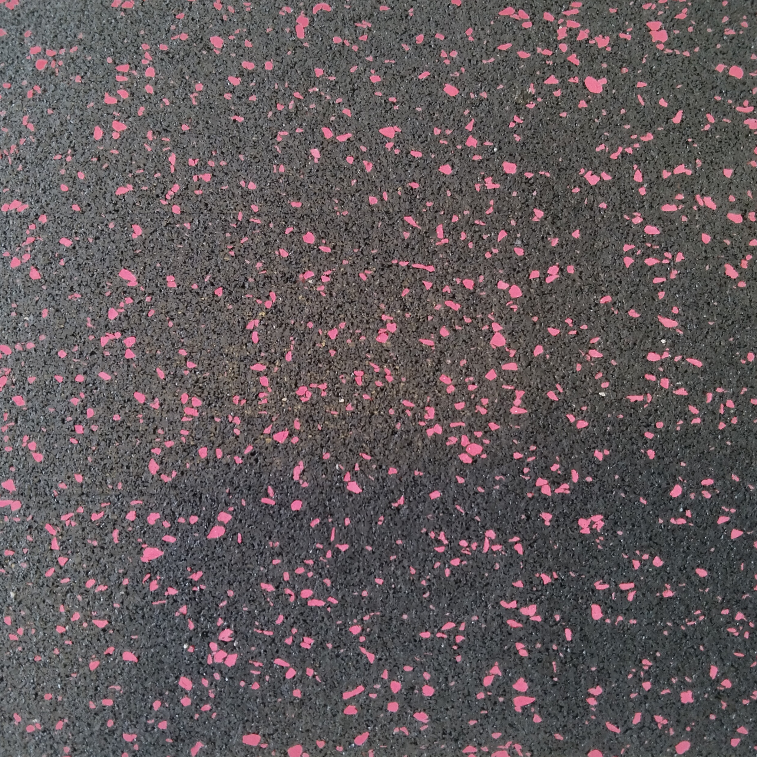 Close corner view of red Smirna Series 10mm flooring  
