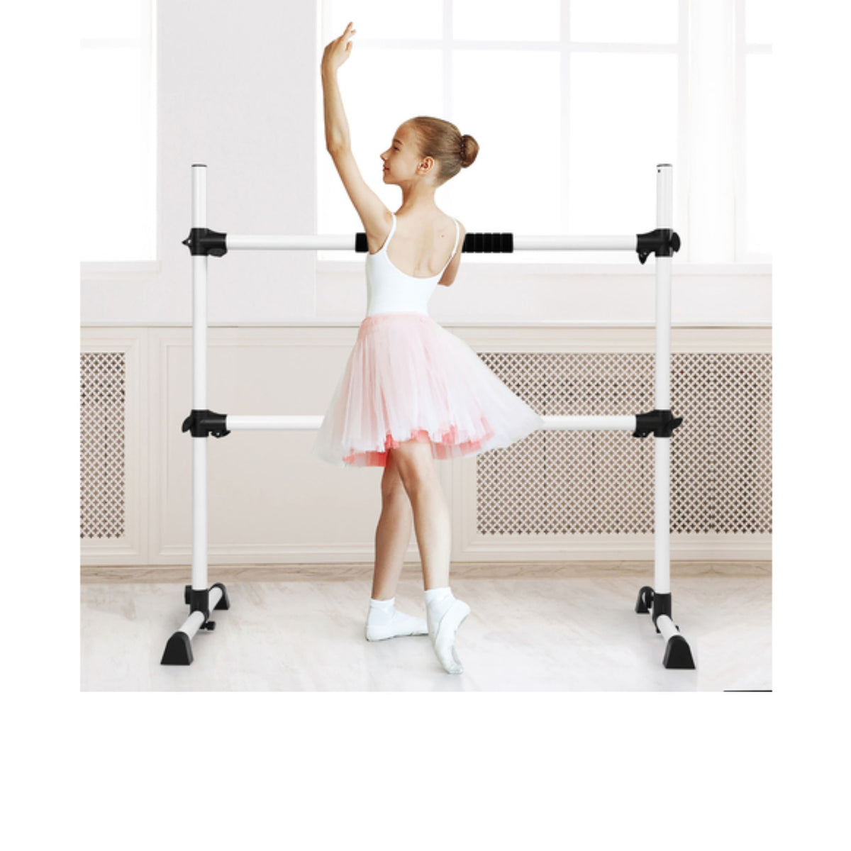 Freestanding ballet barre used by instructor in training session  
