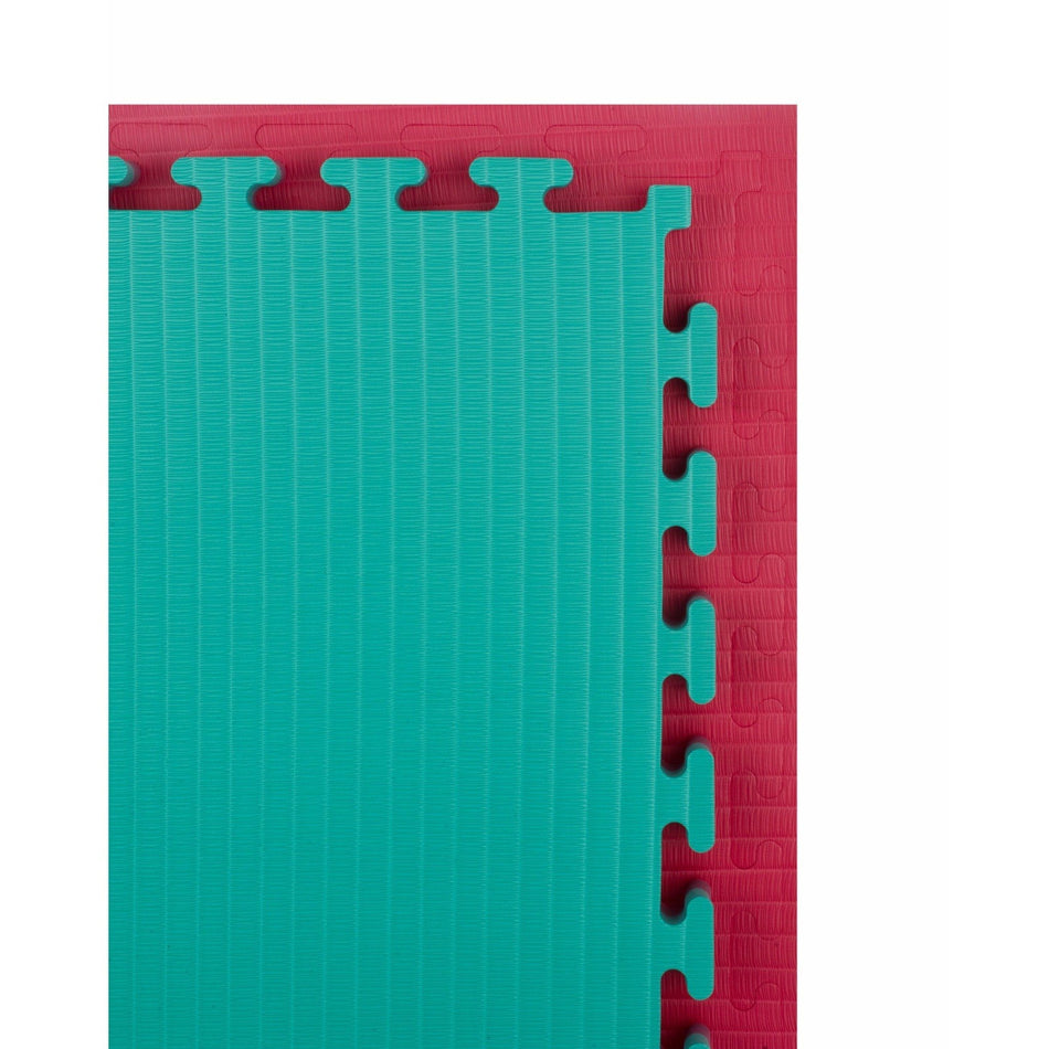 Two tatami jigsaw mats laid flat side-by-side, one red side up and one green side up, to highlight the reversible design.