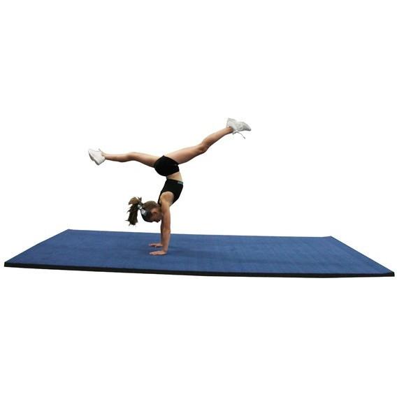 Gymnast performing on Cannons UK 3m blue rollaway gymnastics mat, designed for balance, tumbling, and martial arts training.