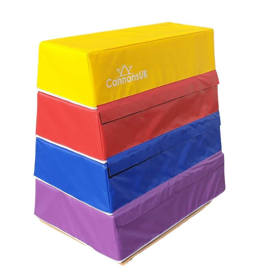 Cannons UK 4 tier foam vaulting box angled stack view in yellow, red, blue and purple for vault approach drills and beginner gymnastics