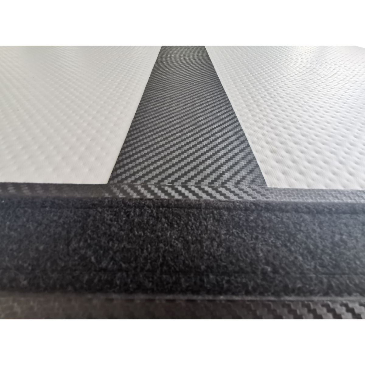 Air Track Pro 3×1×10cm — black (carbon pattern) macro surface/texture close-up on white for material detail