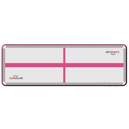 Pink Extreme air floor — flat top view with centre cross line for alignment during tumbling and cheer practice. 