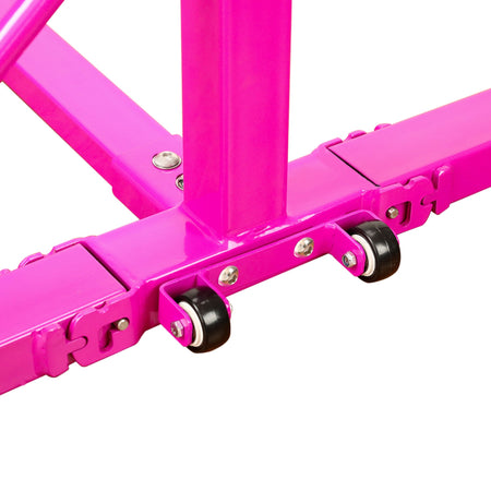 Pink base underside showing transport wheels — easy roll-away storage after practice