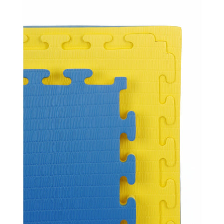 Jig-saw edge close-up of the yellow side of the 40mm Premium Yellow & Blue tatami MMA mat, showing textured top and precise cut-edge.