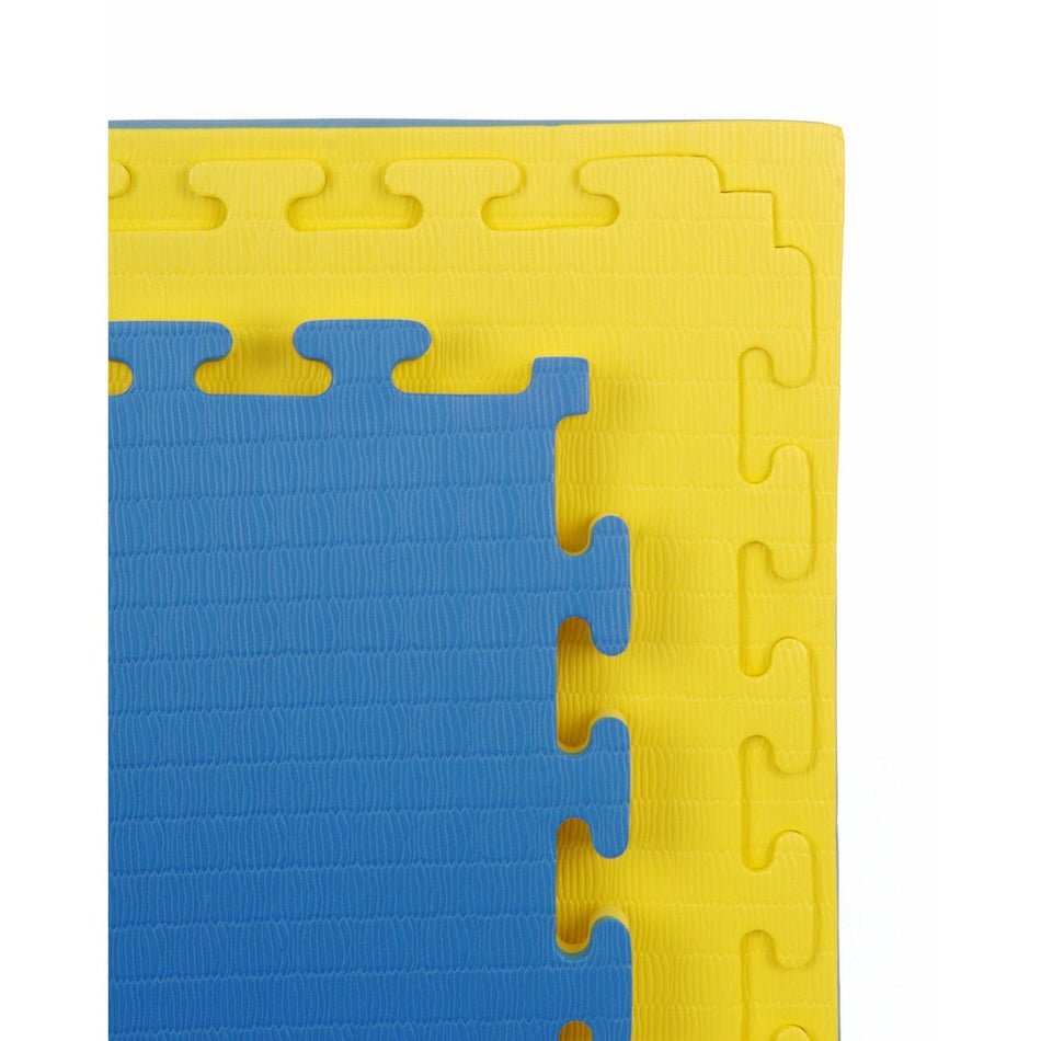 Jig-saw edge close-up of the yellow side of the 40mm Premium Yellow & Blue tatami MMA mat, showing textured top and precise cut-edge.